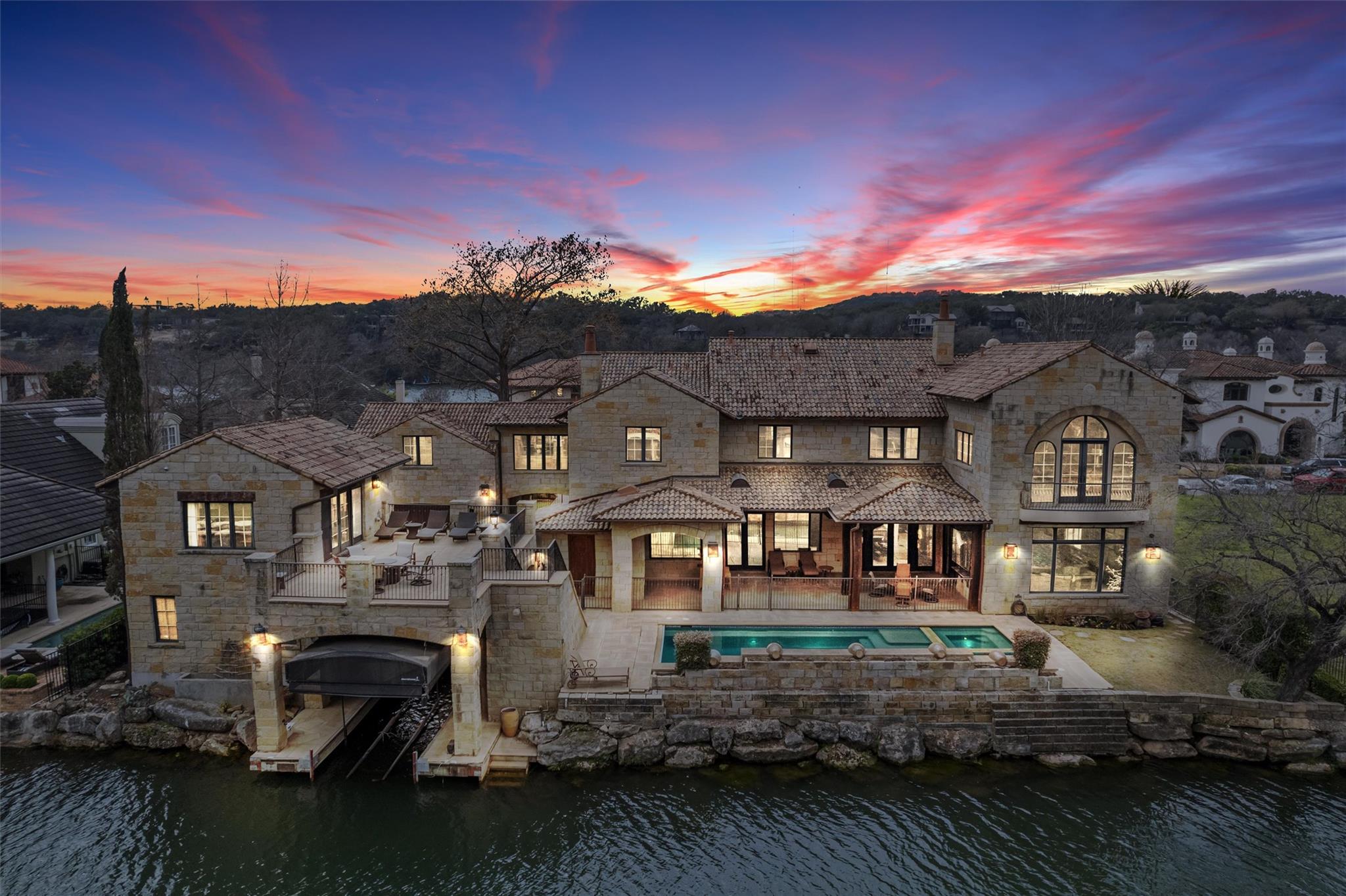 Waterfront estate at sunset