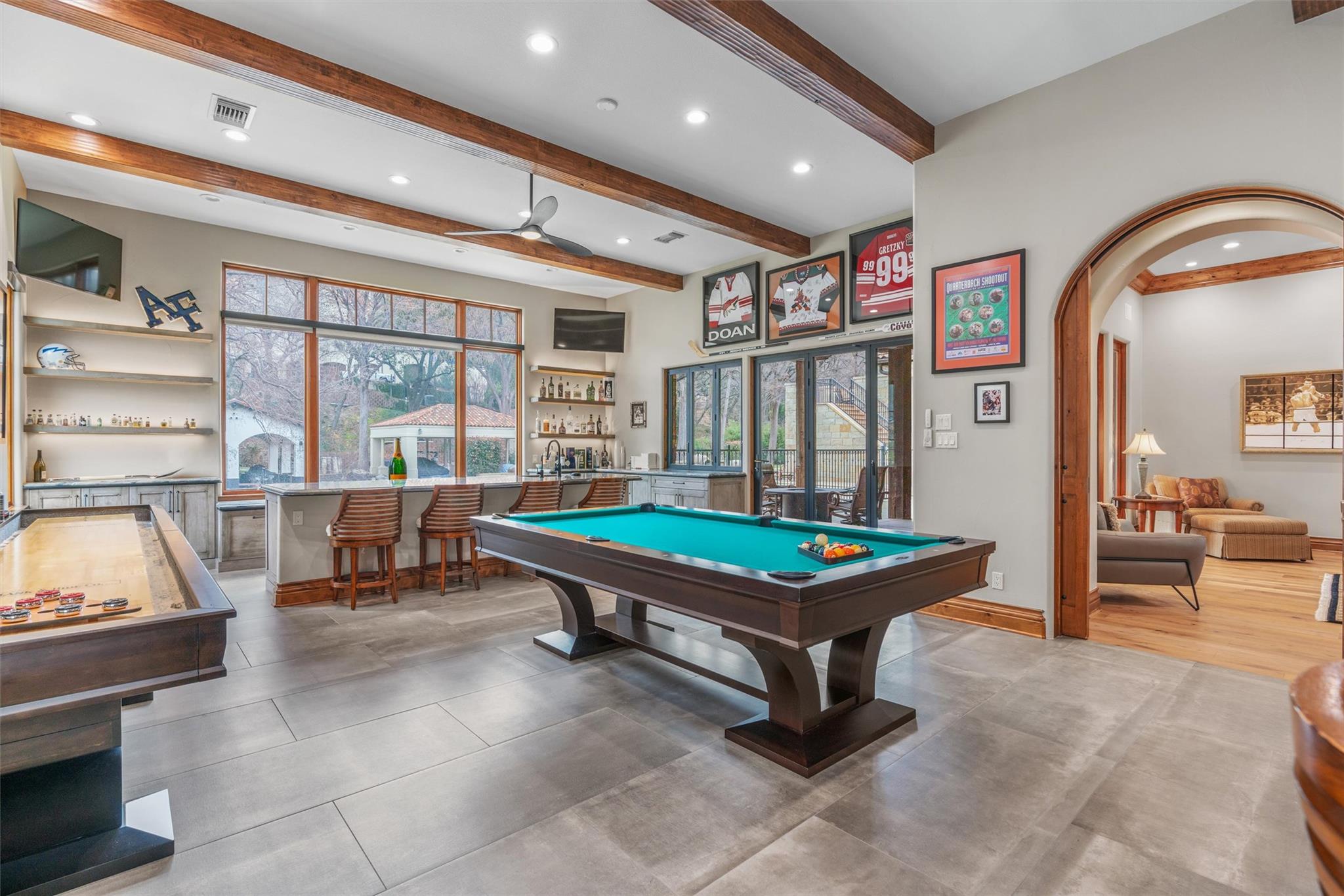 Game room with bar and pool table